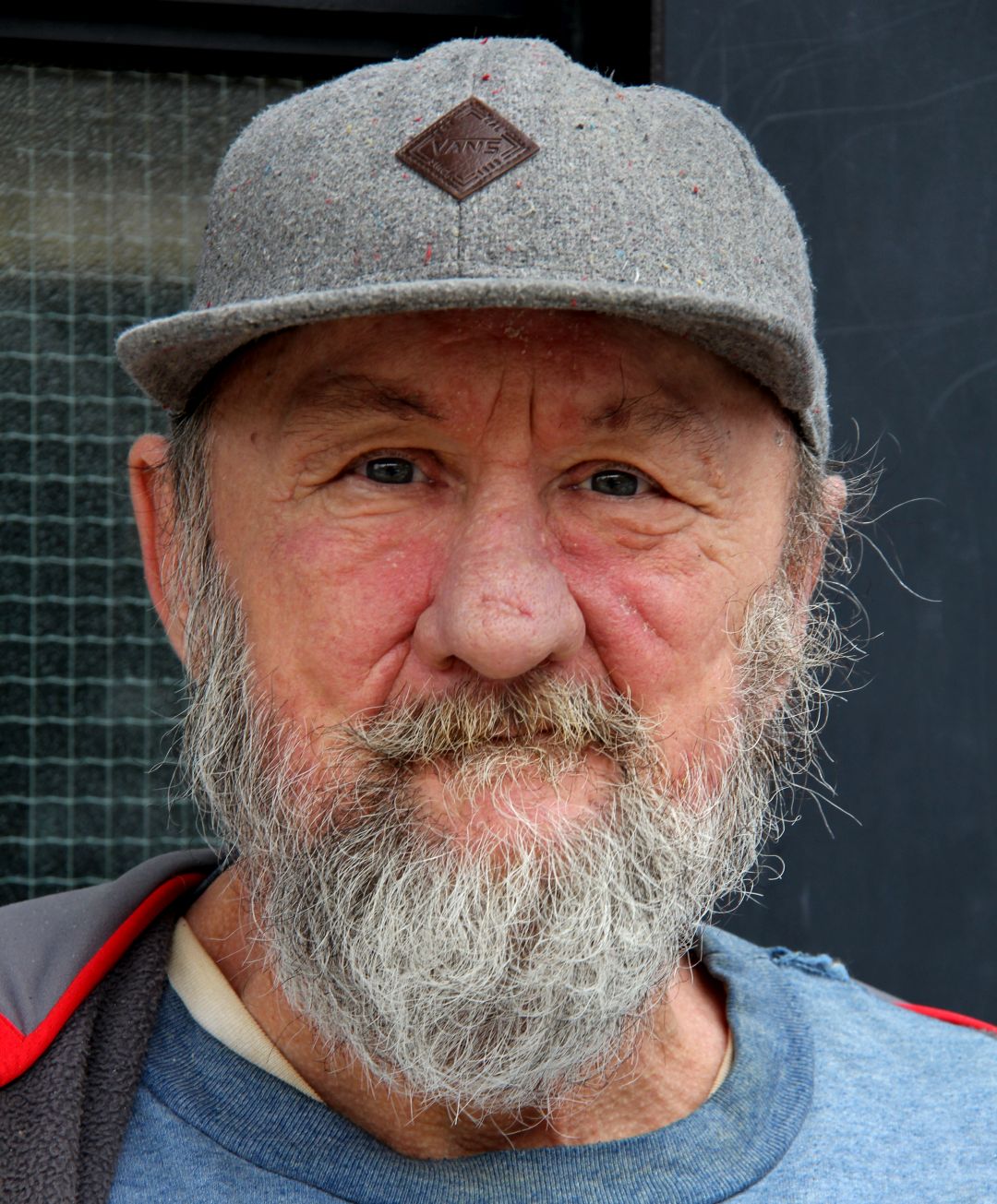 "French" is a senior panhandler stationed at Toronto Queen Street West near Trinity Park